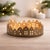 Create a warm seasonal glow with the Cut Metal Village Candle Holder. Finished in a festive gold tone with subtle...