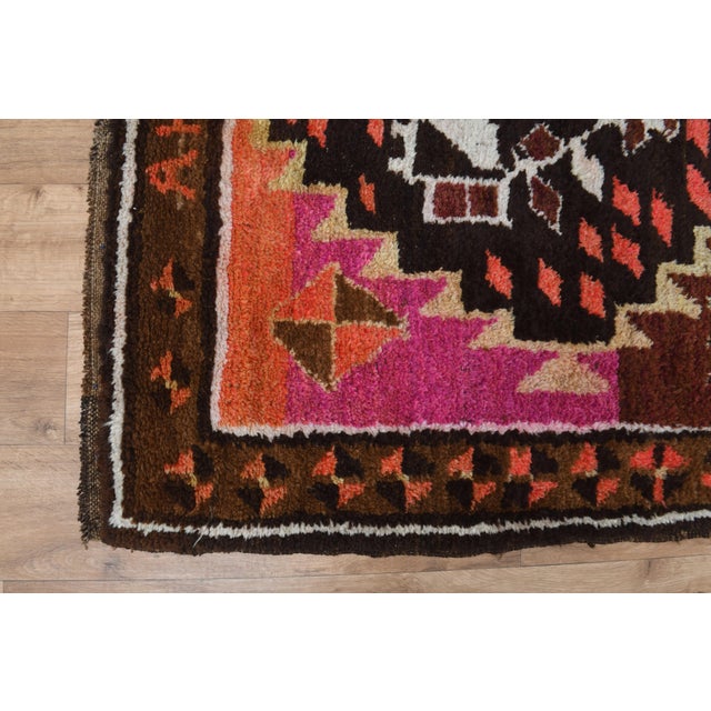 Vintage Hand-Knotted runner rug is a semi-antique vintage runner rug. The '70s Eastern region of Anatolia's unique rug is...