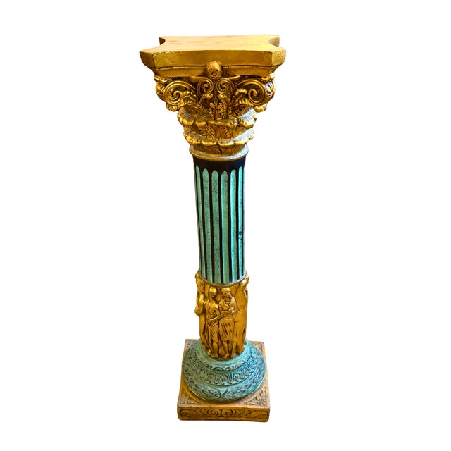 A striking Italian neoclassical column pedestal, richly adorned with sculptural figures and finished in a beautiful aged...