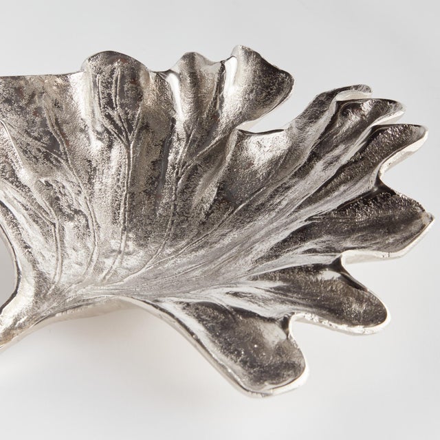 A traditional method of sand casting by hand is what creates the natural leaf details. Made of aluminum, this substantial...