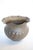 A trumpeted brass hand hammered planter is a stunning decorative container crafted from brass. This planter features a...