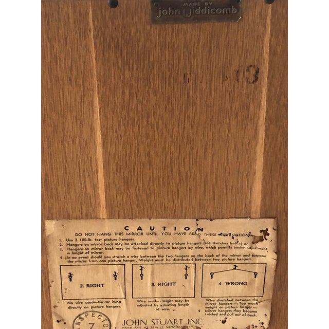 Mid Century brutal/brutalist mirror by John Widdicomb. Thin profile with iconic arched tips.