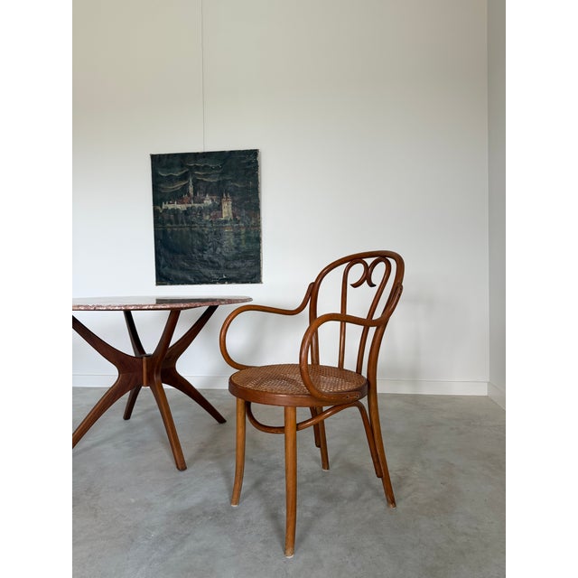 Bentwood Thonet armchair 20.13”W x 25”D x 35.25”H with an 18.25”H seat and 27.38”H arms