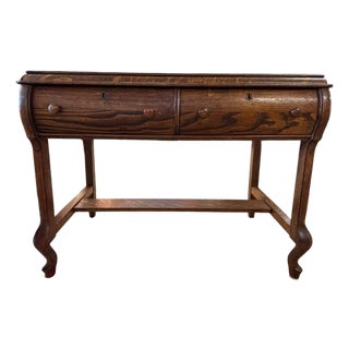 Early 20th Century Figured Oak Two-Drawer Writing Table With Stretcher Base Circa 1920 For Sale