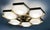 Italian midcentury flush mount with six glossy white Murano glass shades mounted on solid brass frame in satin brass...