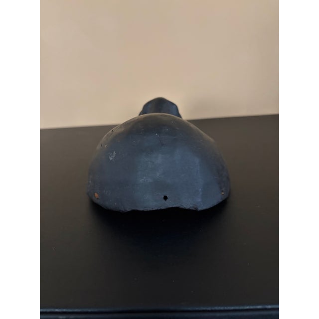 African Dan Mask. 20th century from Ivory Coast. This has some wear and tear from aging. It has some minor cracks that has...