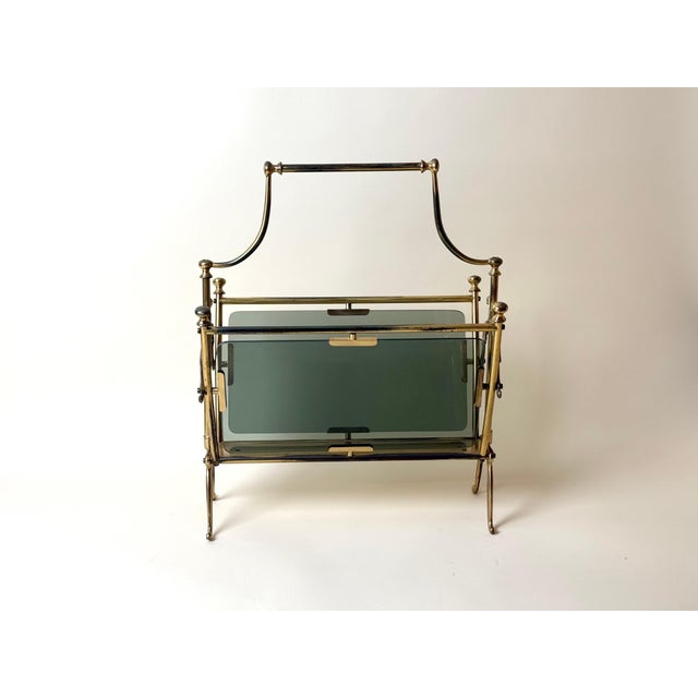 An exceptionally elegant Italian magazine and newspaper rack, crafted in Italy circa the 1950s from brass and substantial...