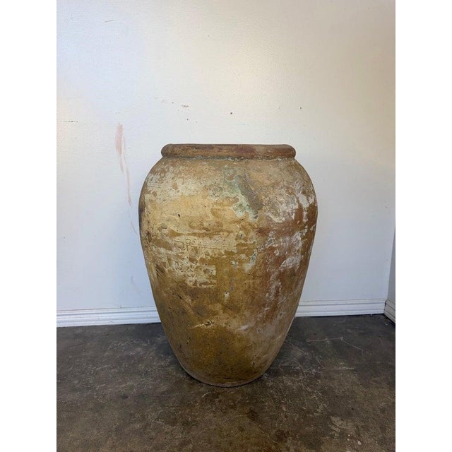 A monumental and deeply evocative antique-style olive jar, also known as a Biot jar, showcasing an extraordinary,...