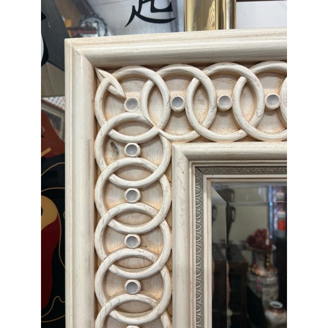 Amazing repeat pattern mirror with wide border and beveled mirror. The whitewash wood frame with lustrous painted finish...