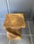 Made of solid walnut, carved from a single piece of wood. There are a few cracks, but the stool is perfectly stable and...