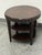 Design Plus Gallery presents a Scallop Edge Tiered Side Table. This round side table is designed with an espresso-toned...