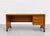 Beautifully crafted Mid Century Modern Teak Danish desk by Denka, Made in Denmark. It features a long, spacious tabletop...