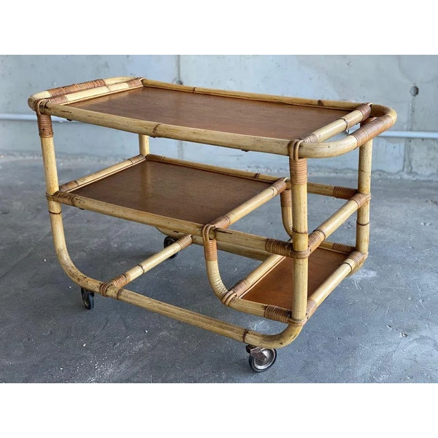 A charming trolley from the 1940s. The car comes in rolls and is made of bamboo and rattan. His geometric linear styling...