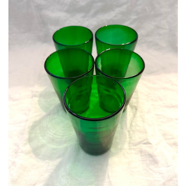 Vintage set of 5 Emerald Green Drinking Glasses, handblown all a little different in size but pretty close. Maker unknown....