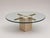 This stylish vintage coffee table combines a thick glass tabletop with an elegant travertine and brass base. The...
