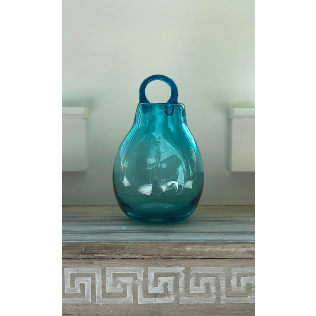 This beautiful ocean blue, blown glass, wall vase is ready to brighten up your walls. Fill it with flowers or your...