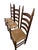 Striking set of three vintage American ladder-back dining chairs featuring exceptionally tall, graceful backs, elongated...