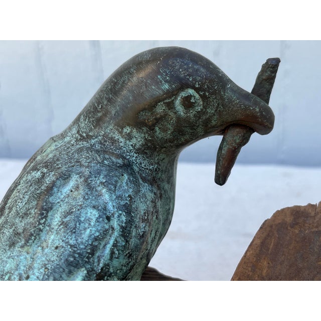 Dynamic bronze of a bird mounted by the artist on a branch of found wood. Wonderful movement and composition capturing a...