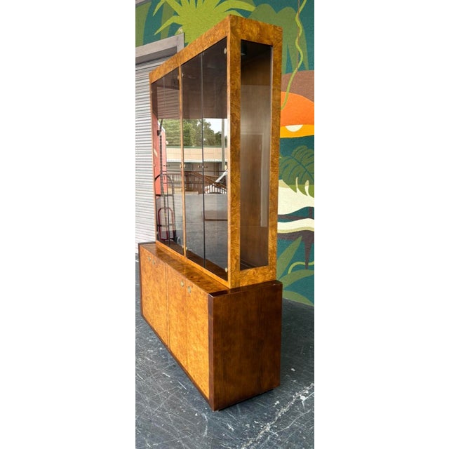Century Furniture is known for their quality designs usually with burl facades and durable builds. This two piece display...