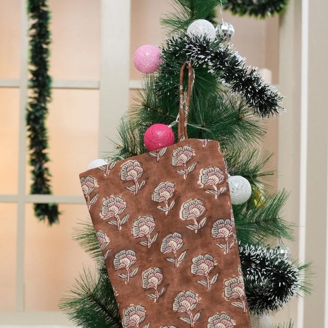 Celebrate the season with this Artisan Pure Linen Stocking in a warm brown hue, featuring the Rohini hand block print...