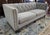 This Stickley Draper Sofa is upholstered in a versatile greige fabric with deep button tufting across the back and arms...
