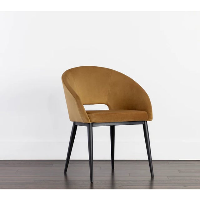 This compact barrel back dining armchair is effortlessly cool. Stocked in gold sky fabric with a black powder-coated steel...