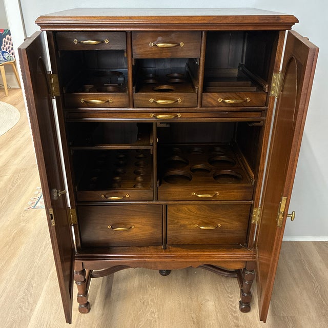 One of a kind-rare find! This gorgeous bar cabinet provides storage for a variety of stemware and glassware, along with...