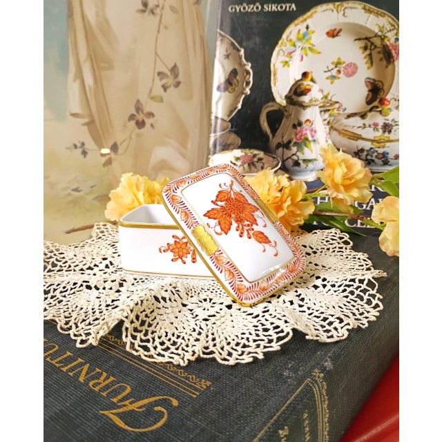 This rare miniature twin-handled porcelain tray, handcrafted by Herend Hungary in the beloved Chinese Bouquet Rust...