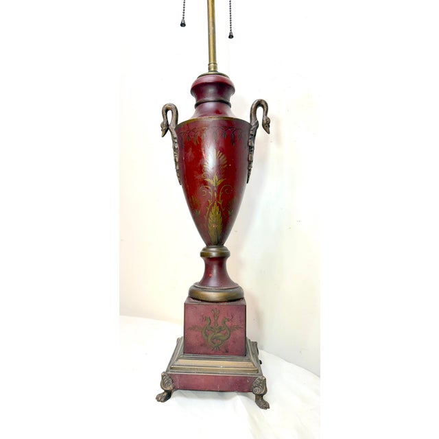 This antique early 1900's hand painted French toleware table lamp is a unique and stylish piece that exudes a sense of...