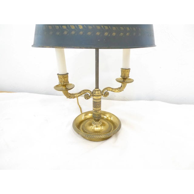 This French bronze lamp with tole bouilotte shade uses two candelabra sockets up to 60 watts each. The shade is a dark...