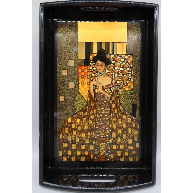 A lovely 20 x 13 inch vintage serving tray with the portrait of 'Woman in Gold' by well known artist, Gustav Klimt. It has...