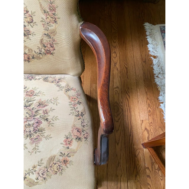 Vintage Louis XV early 1900’s Open Arm Chair. Carved knees and feet. Original upholstery with nail head trim.