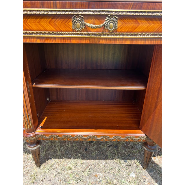 Exquisite 19th-century Louis XVI style sideboard showcasing exceptional craftsmanship with beautifully figured wood...