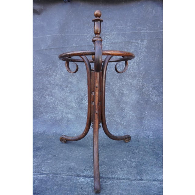 Pictured in the 1904 Thonet catalogue on page 84. It has parted ways with the footed metal dish it sat on formerly that...