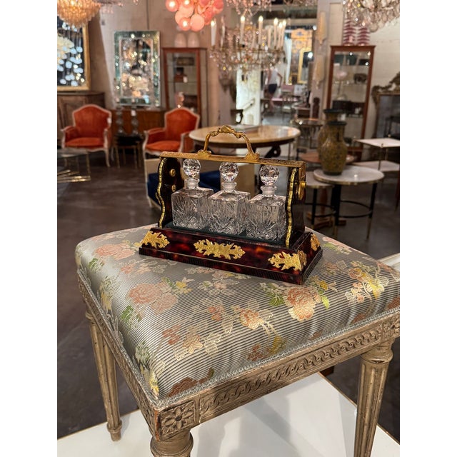 The 19th century English Tortoise and Bronze Tantalus is a unique and collectible barware piece that adds a touch of...