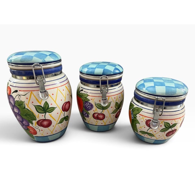 Charming vintage Capriware by Michael’s Orchard hand-painted ceramic canister set featuring three graduated jars with...