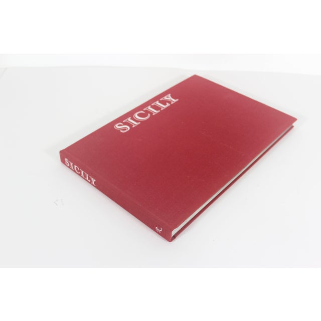 1987 Sicily Rizzoli Red linen hard cover coffee table book. No dust jacket. Very good vintage condition with some...