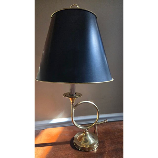 Vintage brass table lamp featuring a classic horn design. This piece combines traditional French bouillotte style with a...