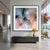 Soft, translucent forms drift and overlap like flowing fabric, blending smoky charcoal, blush, coral, amber, and cool blue...