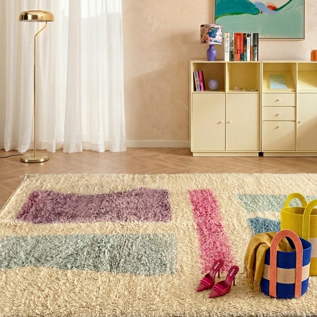 Playful rectangular blocks of lavender, sage, and shimmering pink float across a warm ivory field — soft, artistic, and...