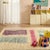 Playful rectangular blocks of lavender, sage, and shimmering pink float across a warm ivory field — soft, artistic, and...