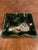 A charming set of kozara or side plates in the Oribe pallet. Deep green glaze and ruffled edges, each with a traditional...