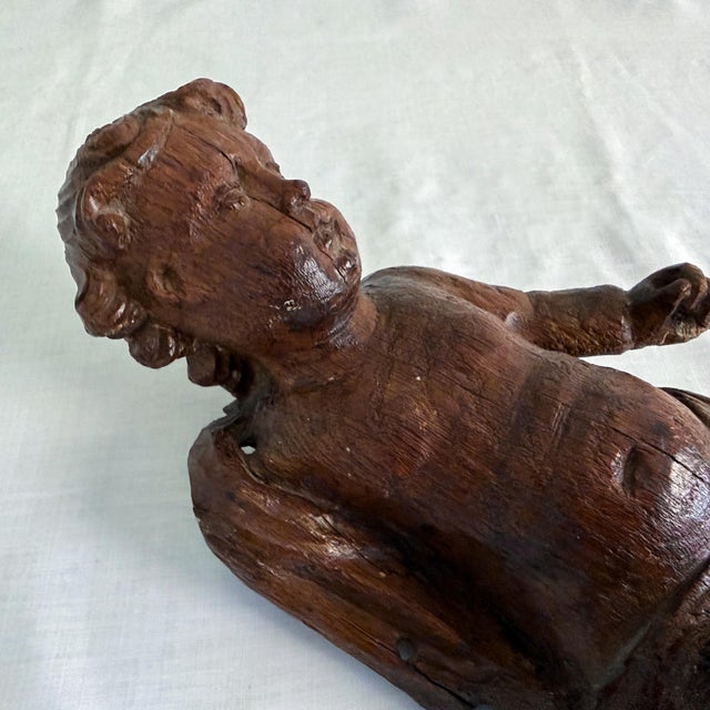 Antique carved wood cherub (or angel, putti, or cupid), a piece of architectural salvage purchased at the Paris flea...