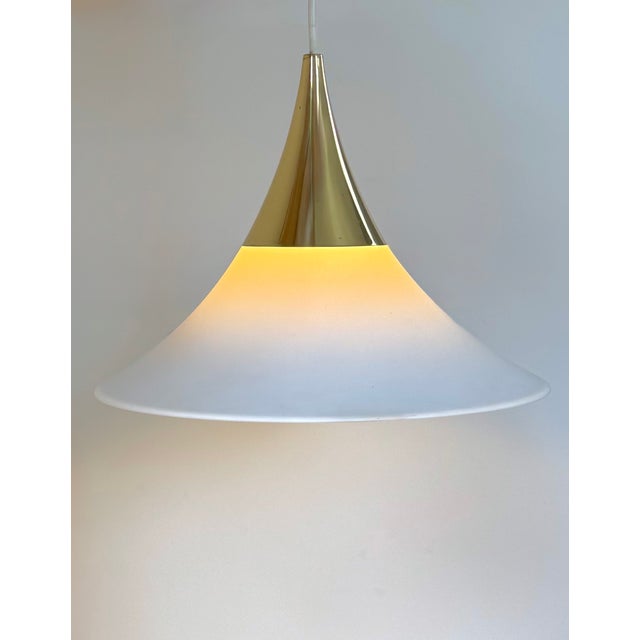 Pair of pendant lights by limburg, made of brass and opaline glass, produced in germany in the 1970s. warm, diffused...