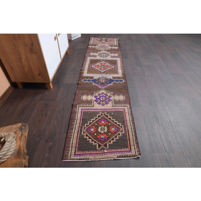 Vintage Turkish Hand-Knotted vintage rug is a semi-Vintage runner rug.'70s Eastern region of Turkey's unique rug is...