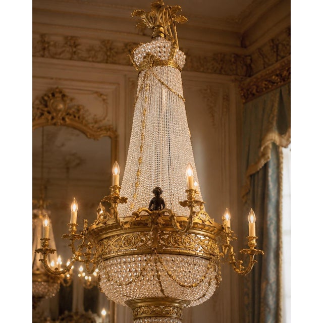 This impressive mid-20th-century French Louis XVI–style chandelier combines monumental scale with refined neoclassical...