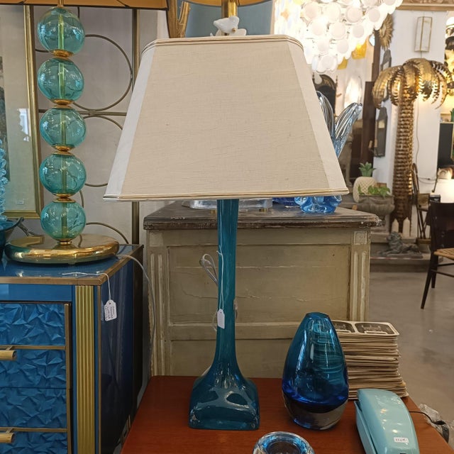 Original French table lamp from the 1960s, made of Daum glass. The entire lamp is crafted from a single piece of blown...
