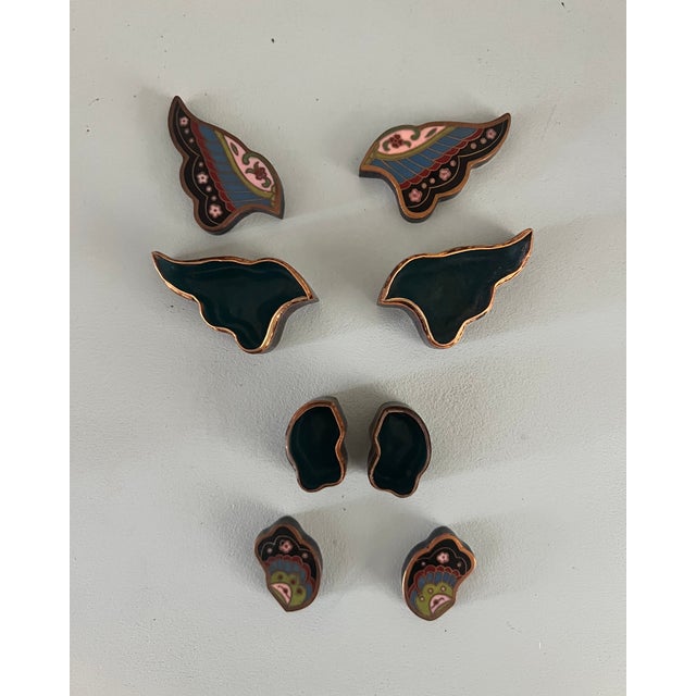 A beautifully detailed vintage cloisonné trinket box in the form of a butterfly, its wings enameled in a rich palette of...