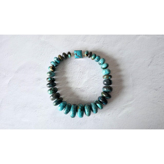 The length of the necklace is 18.5 inches (47 cm). The size of the rondelle beads varies from 16 mm to 33.5 mm. Turquoise...