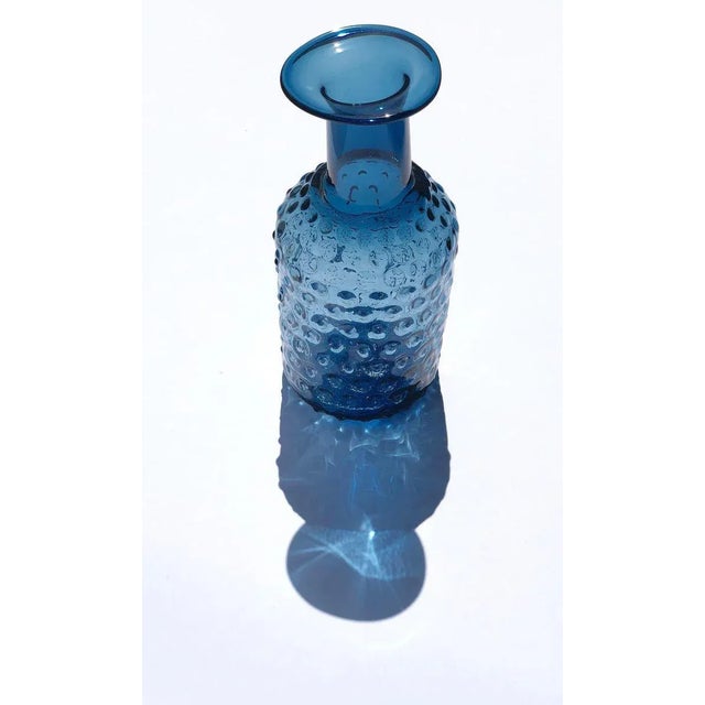 Contemporary Czech studio glass vase or bottle with bumpy facade. The bumps are actually like small optical elements that...